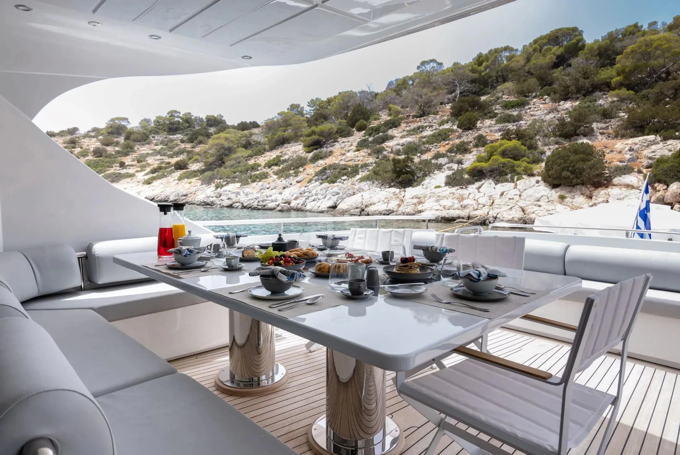 a table with food on it aboard MAC Yacht for Sale