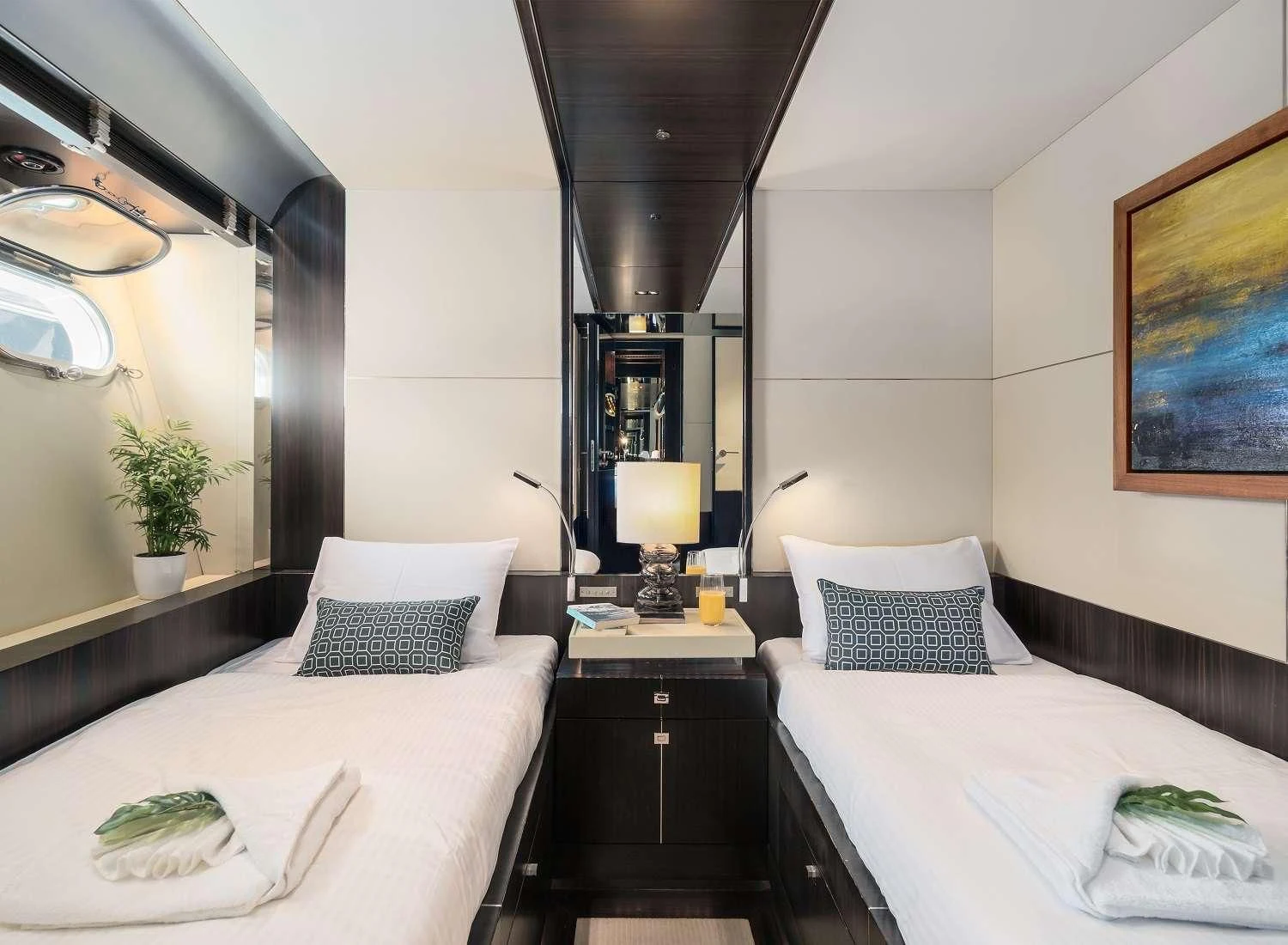a couple of beds in a hotel room aboard MAC Yacht for Sale
