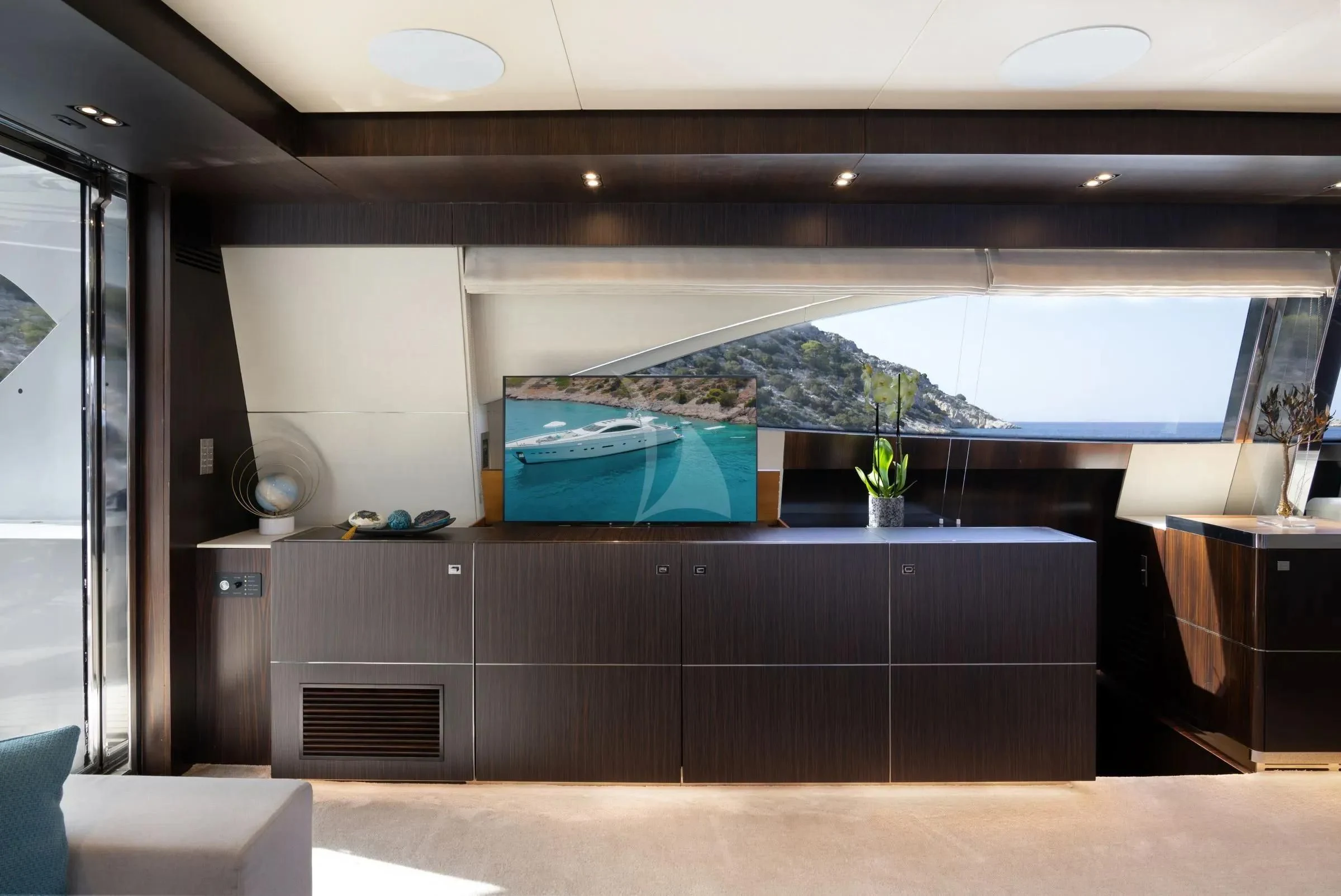 a room with a large screen aboard MAC Yacht for Sale