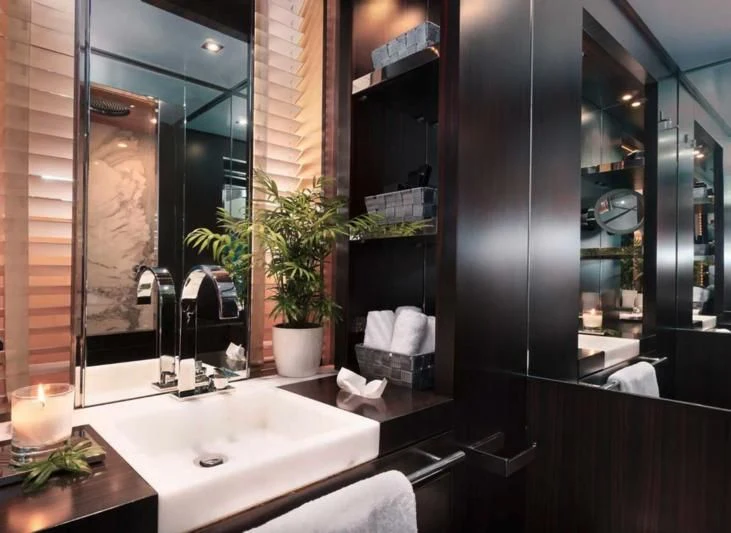 a bathroom with a large mirror aboard MAC Yacht for Sale