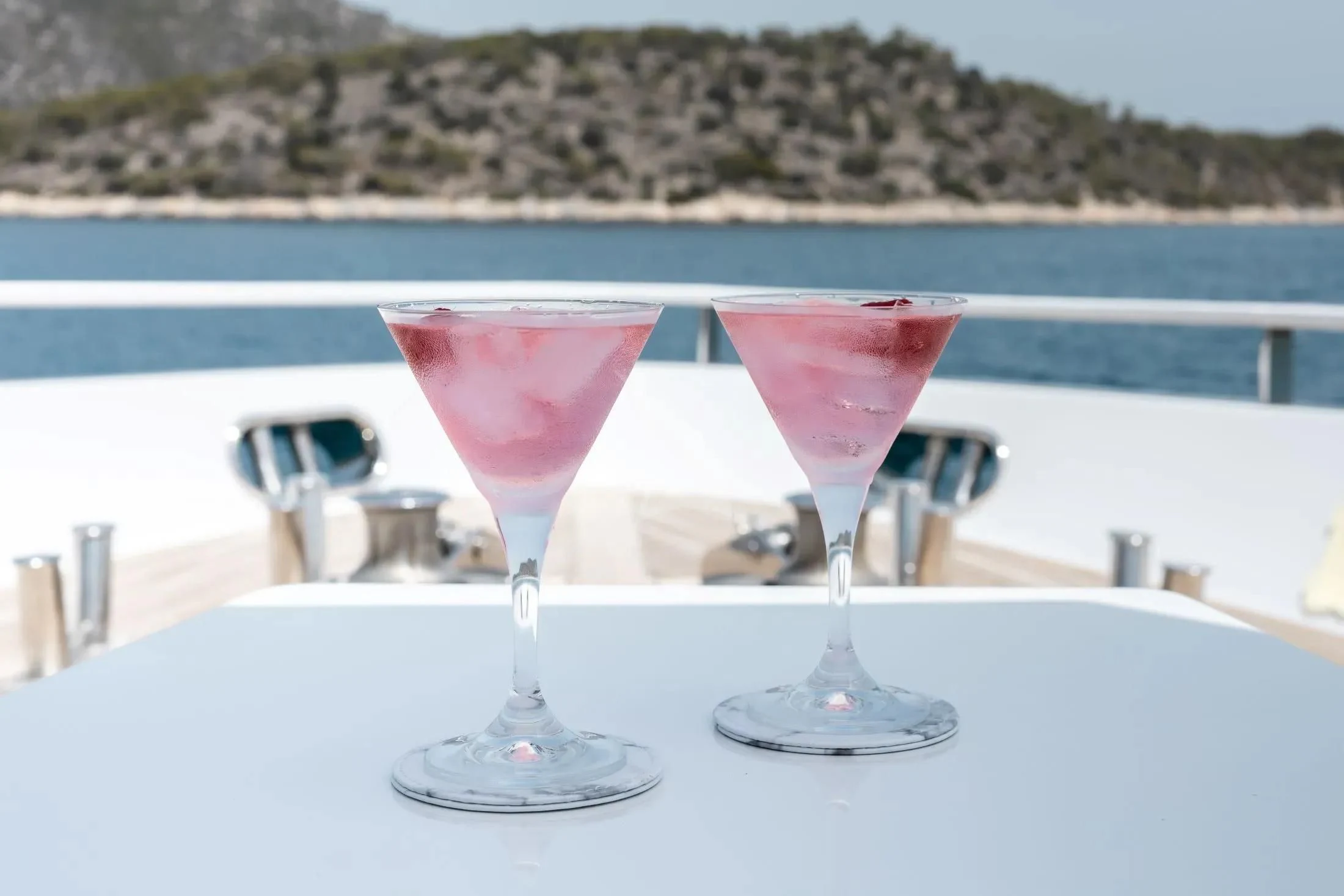 a row of wine glasses aboard MAC Yacht for Sale