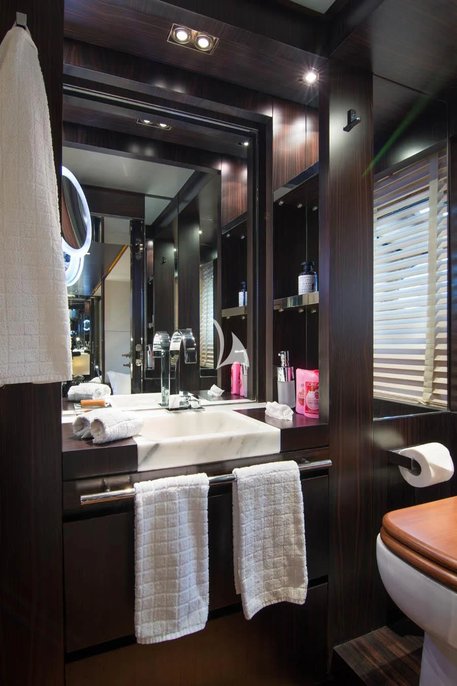 a bathroom with a large mirror aboard MAC Yacht for Sale