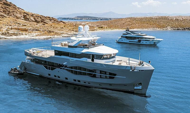 a couple of boats in the water aboard Q.M Yacht for Sale