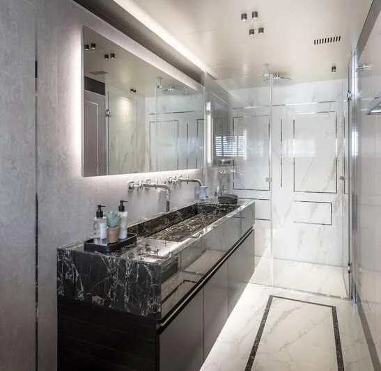 a bathroom with a large mirror aboard ALAIA Yacht for Sale
