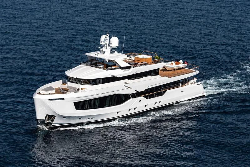 a white yacht on the water aboard ALAIA Yacht for Sale