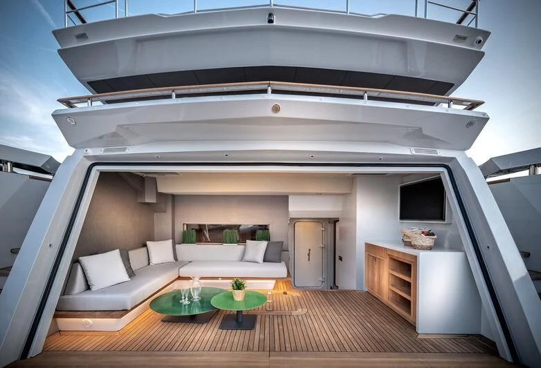 a large white house with a pool table and a couch aboard ALAIA Yacht for Sale