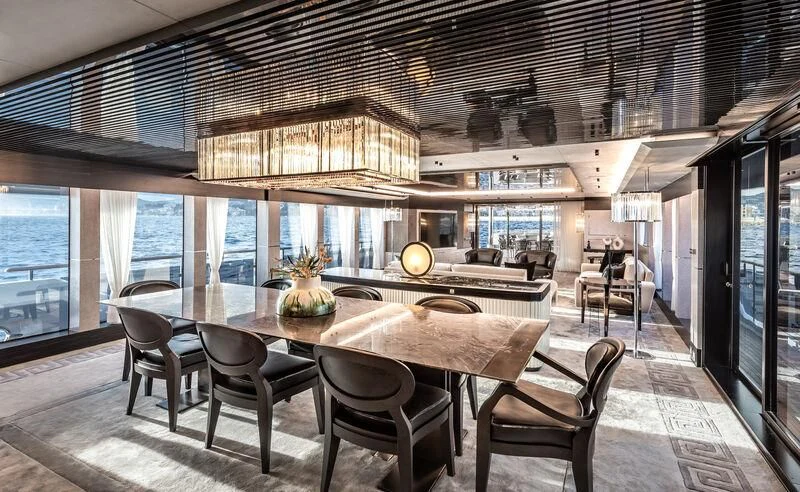 a large dining room with a large table and chairs aboard ALAIA Yacht for Sale