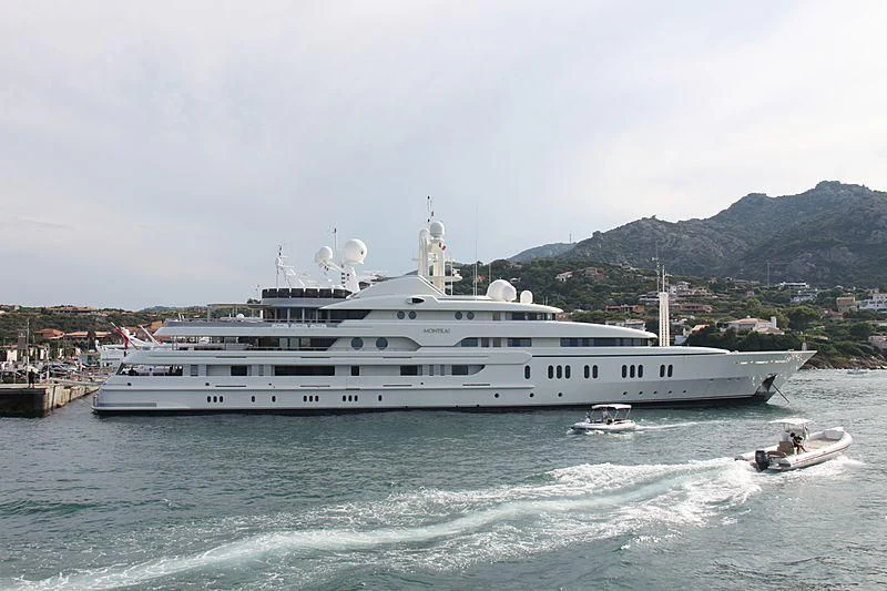 a large white boat on the water aboard MONTKAJ Yacht for Sale
