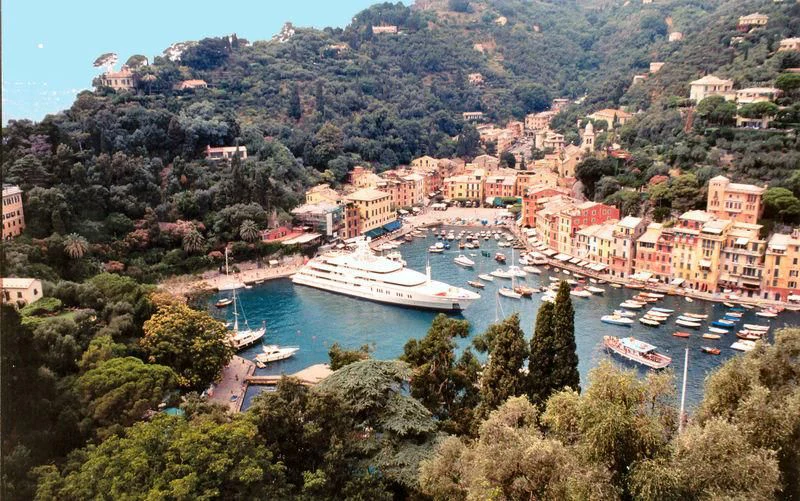 a city with boats and trees aboard MONTKAJ Yacht for Sale