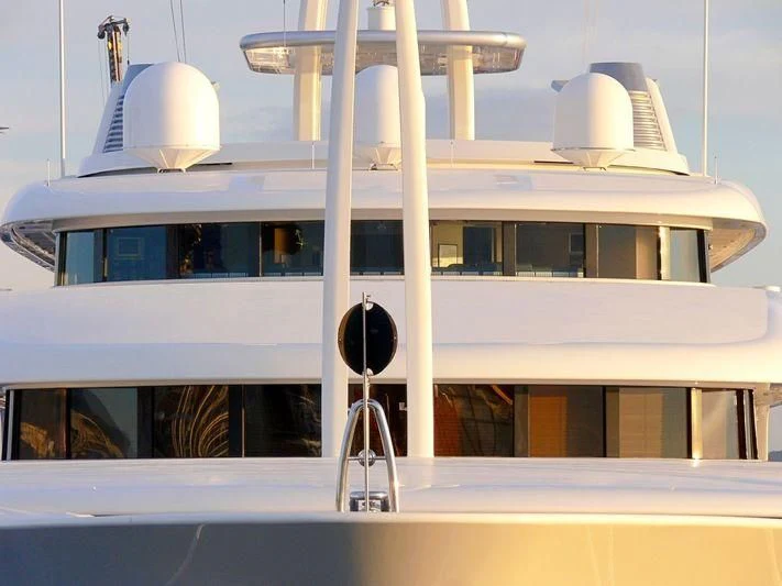 a white boat with a satellite dish on the front aboard MONTKAJ Yacht for Sale
