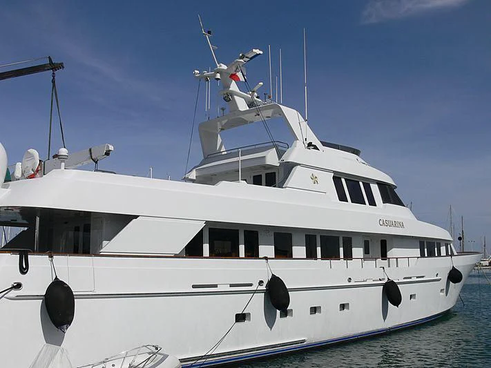 a white yacht with a wind turbine on top aboard CHANSON Yacht for Sale