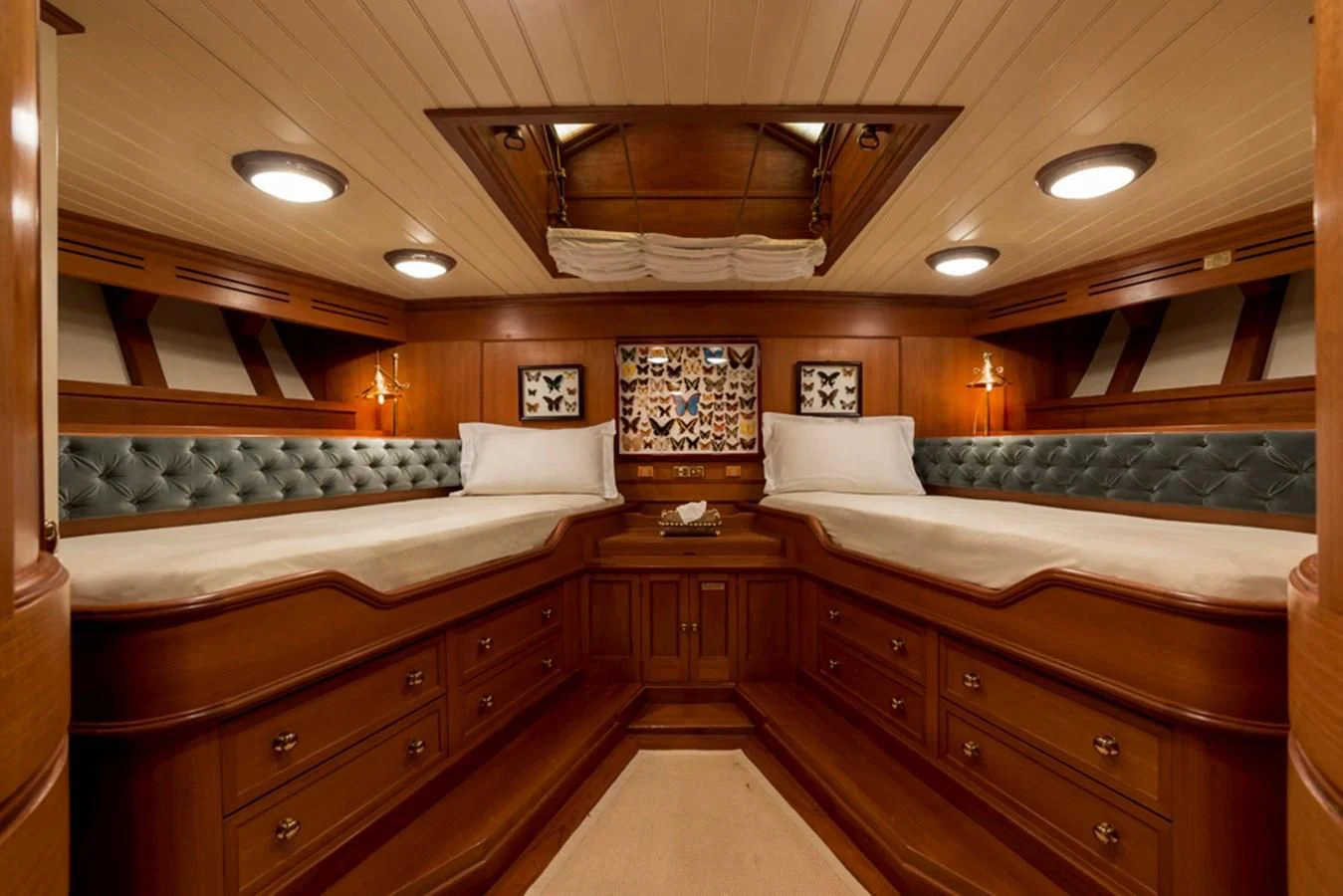 a room with a bed and a couch aboard LADY MAY OF GLANDORE Yacht for Sale