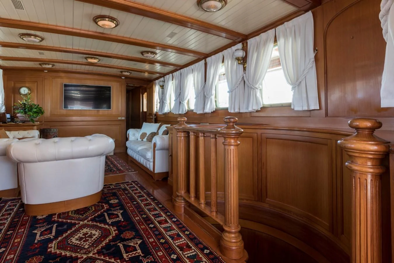 a room with a bed and a table aboard LADY MAY OF GLANDORE Yacht for Sale