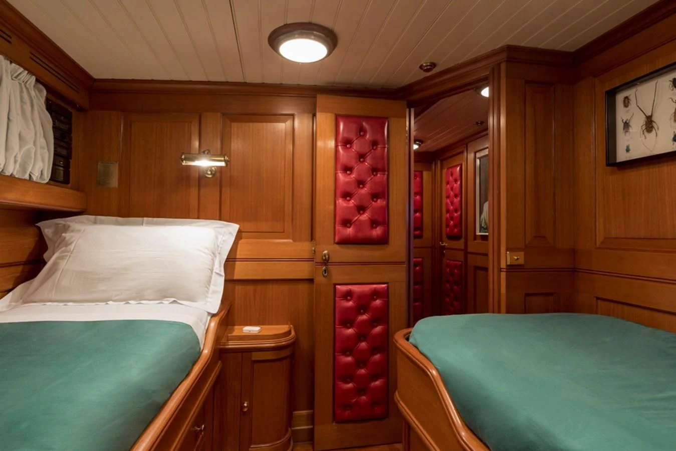 a room with a couple beds aboard LADY MAY OF GLANDORE Yacht for Sale