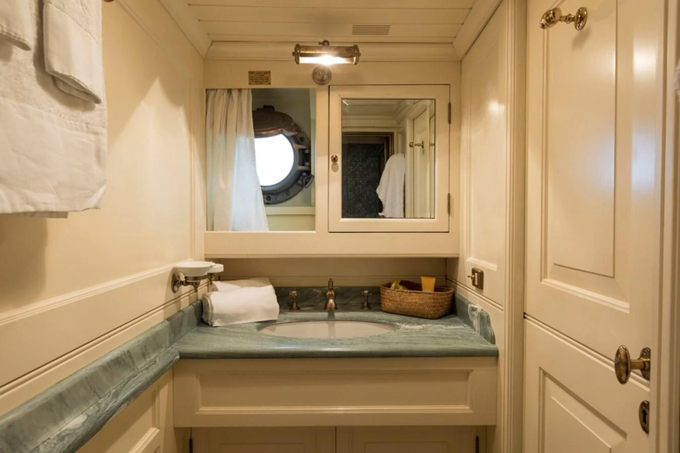a bathroom with a sink and a mirror aboard LADY MAY OF GLANDORE Yacht for Sale