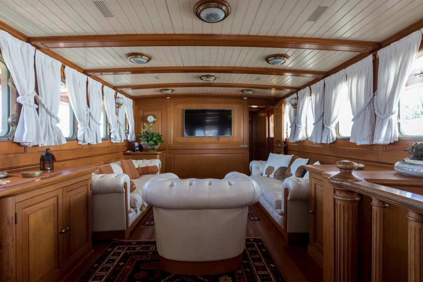 a room with a bed and a bathtub aboard LADY MAY OF GLANDORE Yacht for Sale