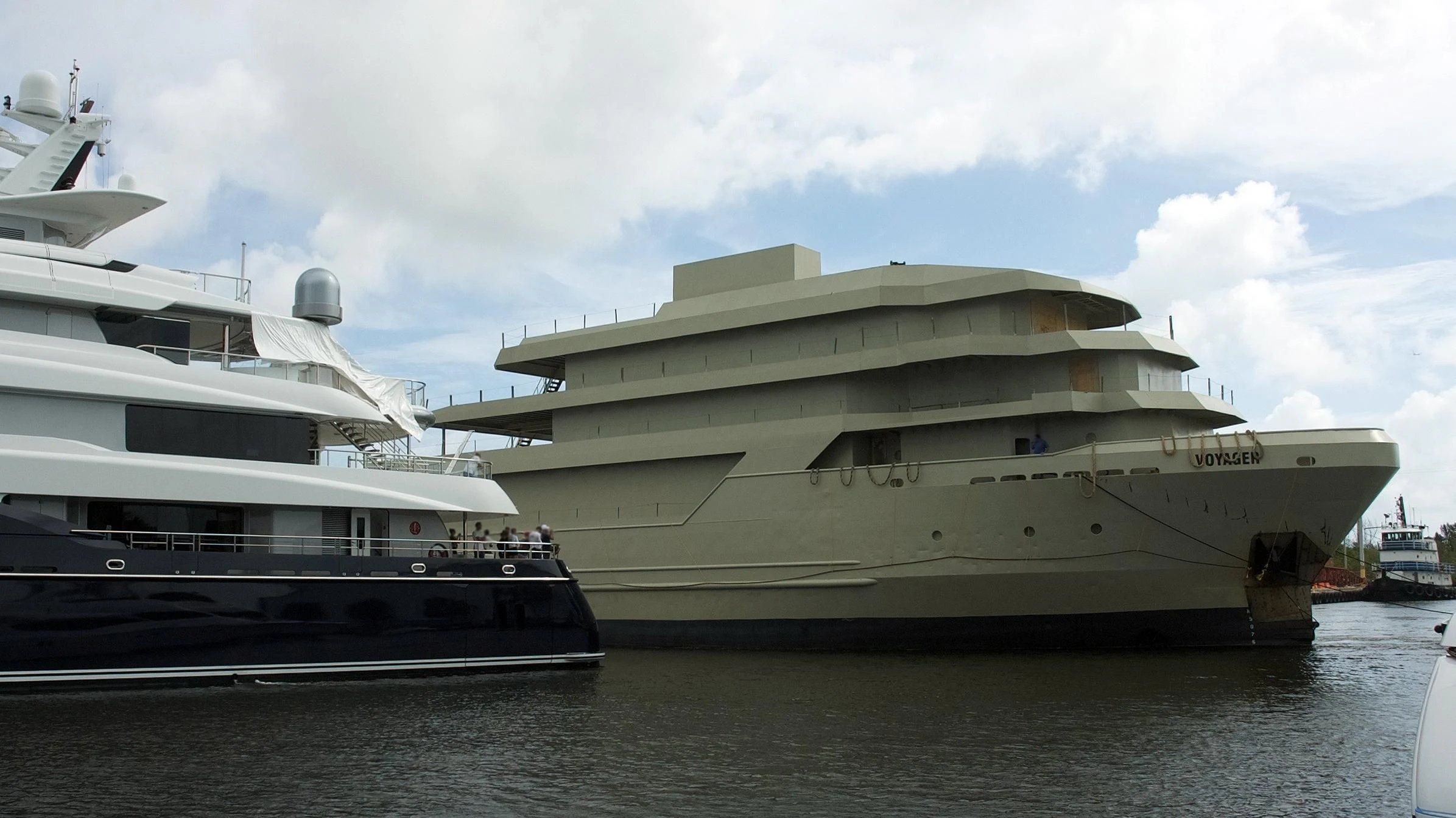 a large cruise ship docked aboard VOYAGER Yacht for Sale
