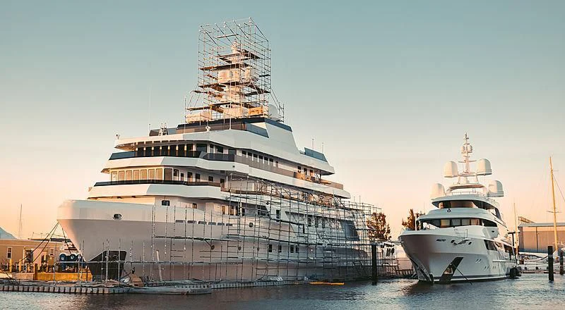 a large cruise ship docked aboard VOYAGER Yacht for Sale