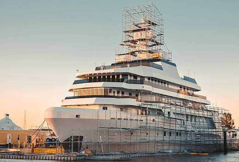 a large cruise ship docked aboard VOYAGER Yacht for Sale