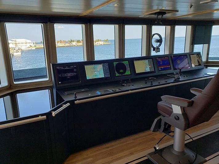 a control room with many monitors aboard VOYAGER Yacht for Sale