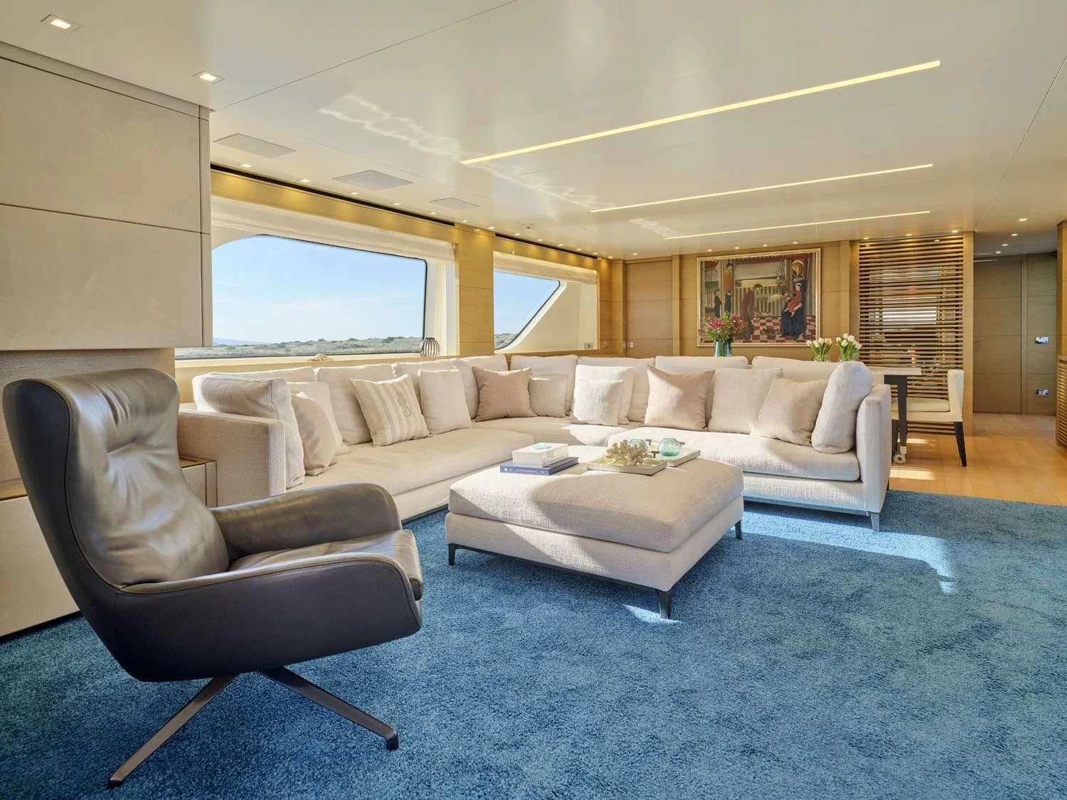 a living room with a couch and a table aboard FLOR Yacht for Charter
