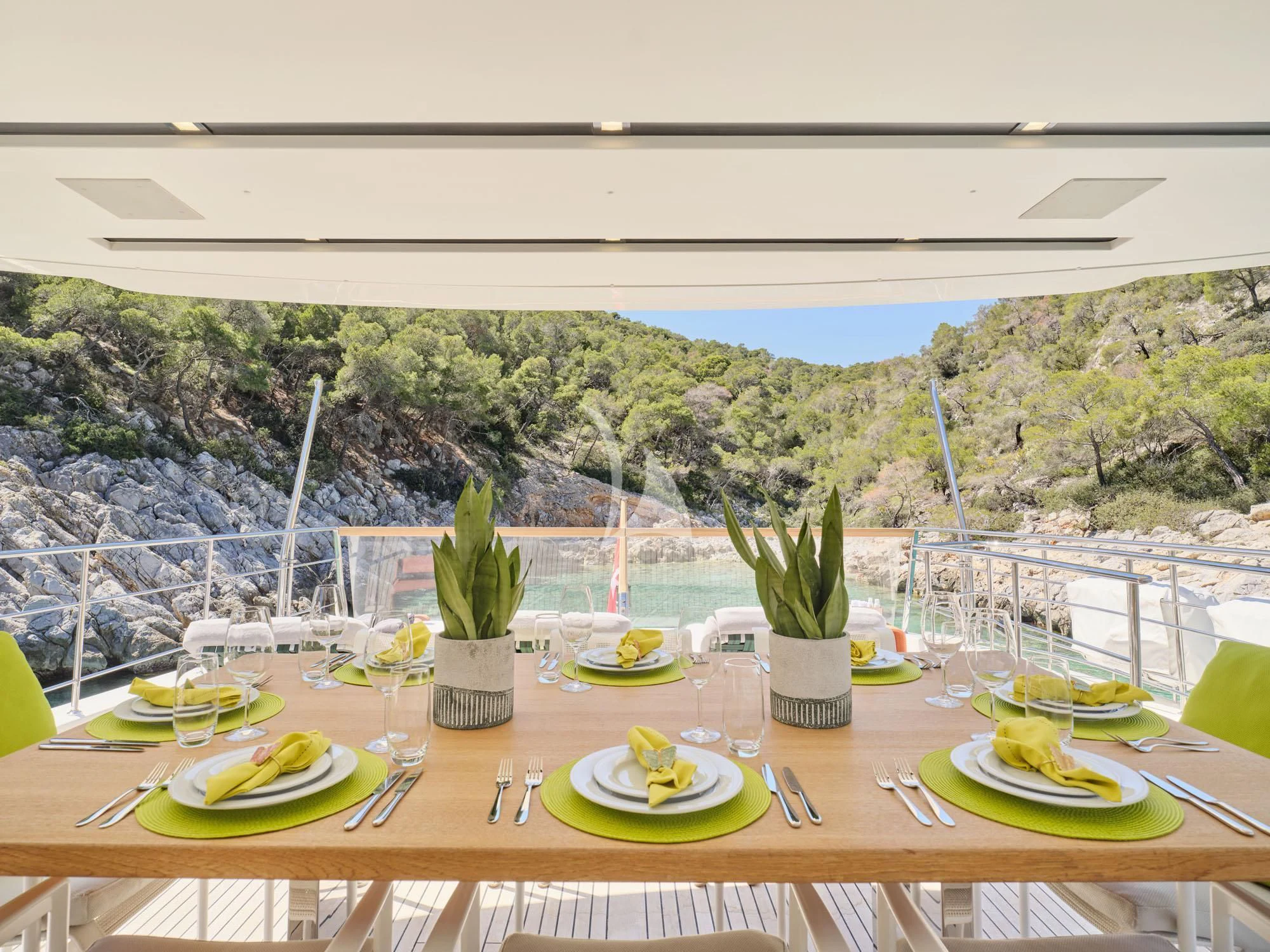 a table with plates and food on it aboard FLOR Yacht for Charter
