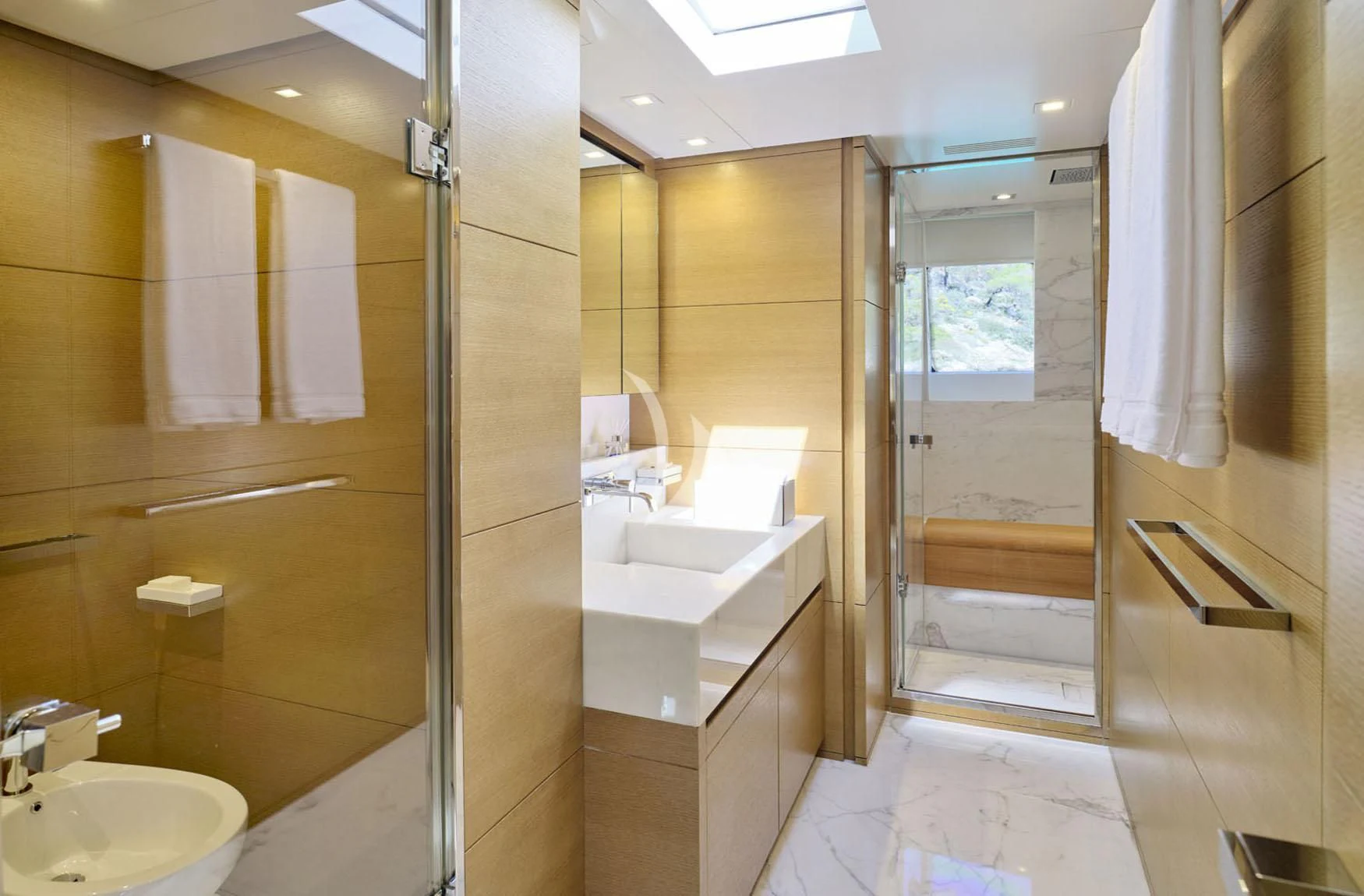 a bathroom with a glass shower aboard FLOR Yacht for Charter