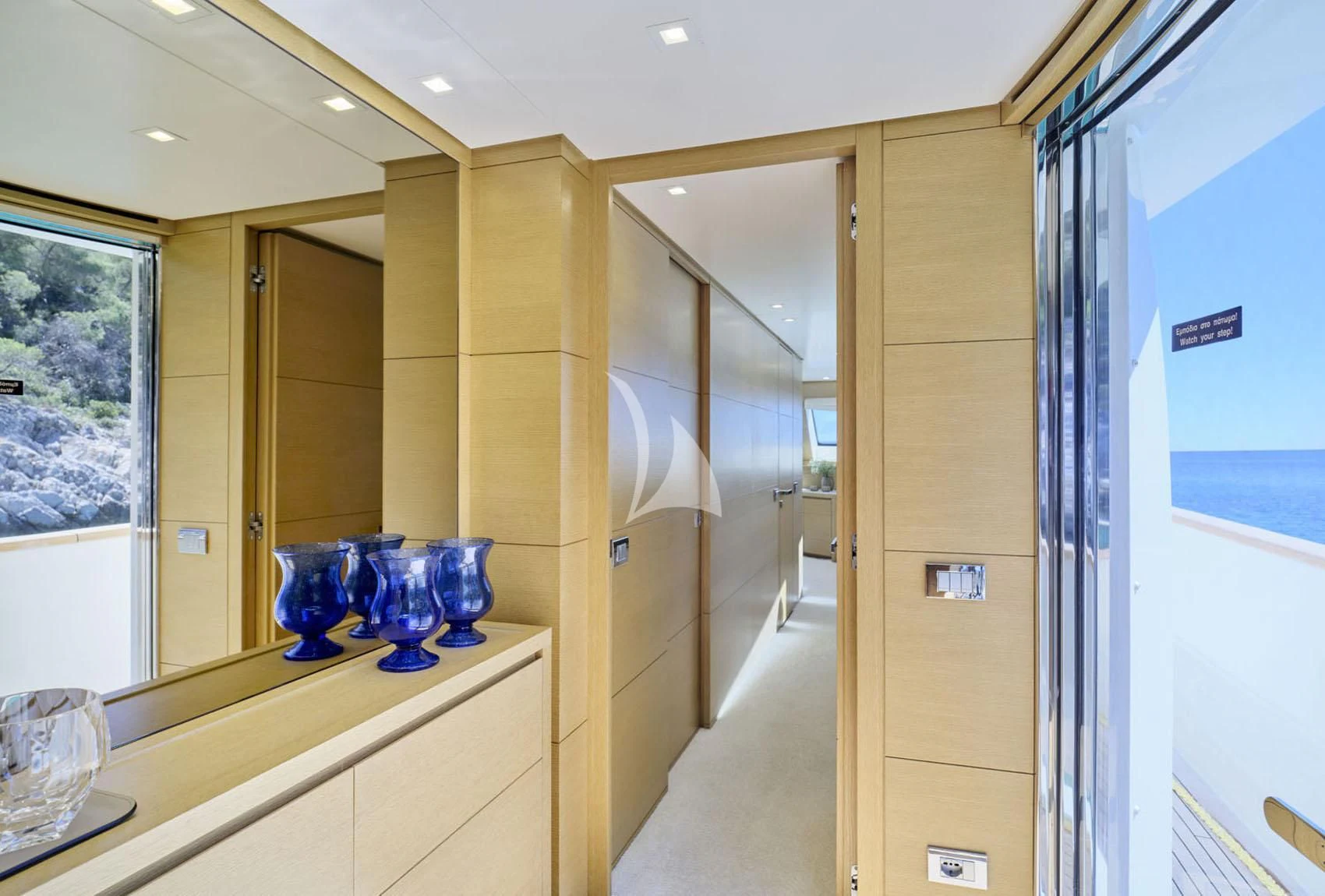 a room with glass vases aboard FLOR Yacht for Charter