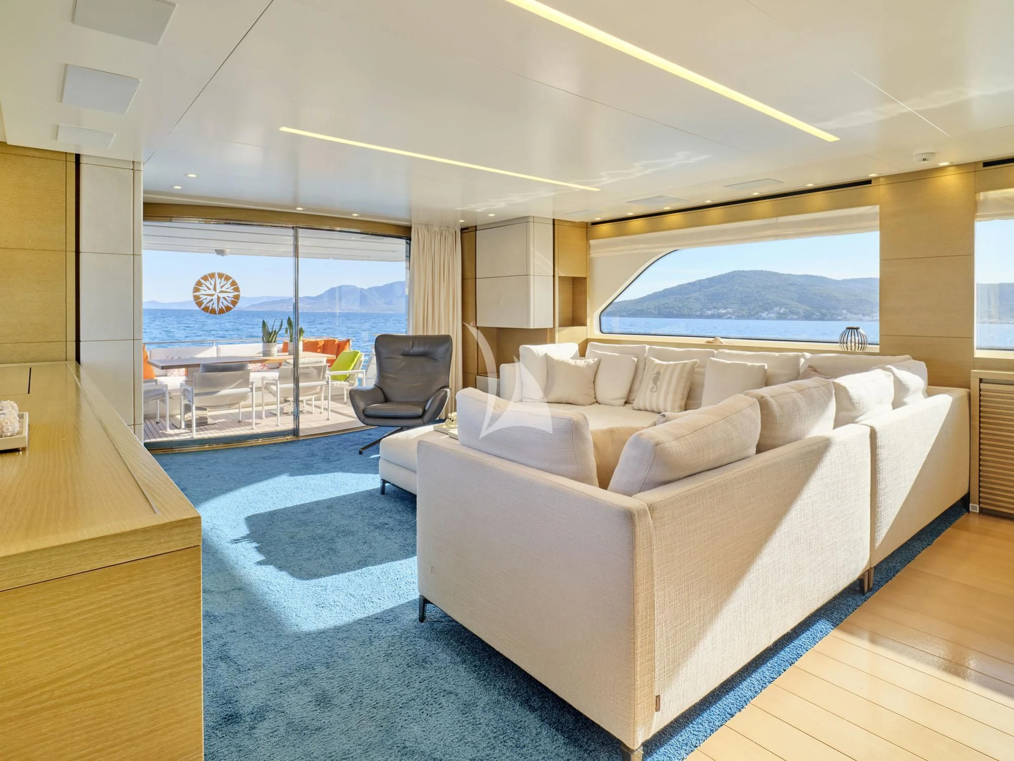 a living room with a large window aboard FLOR Yacht for Charter