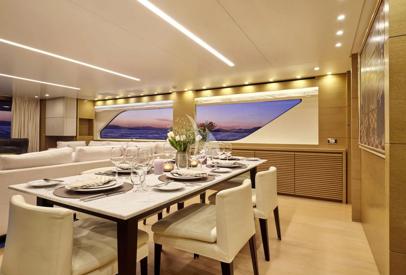 a conference room with a table and chairs aboard FLOR Yacht for Charter