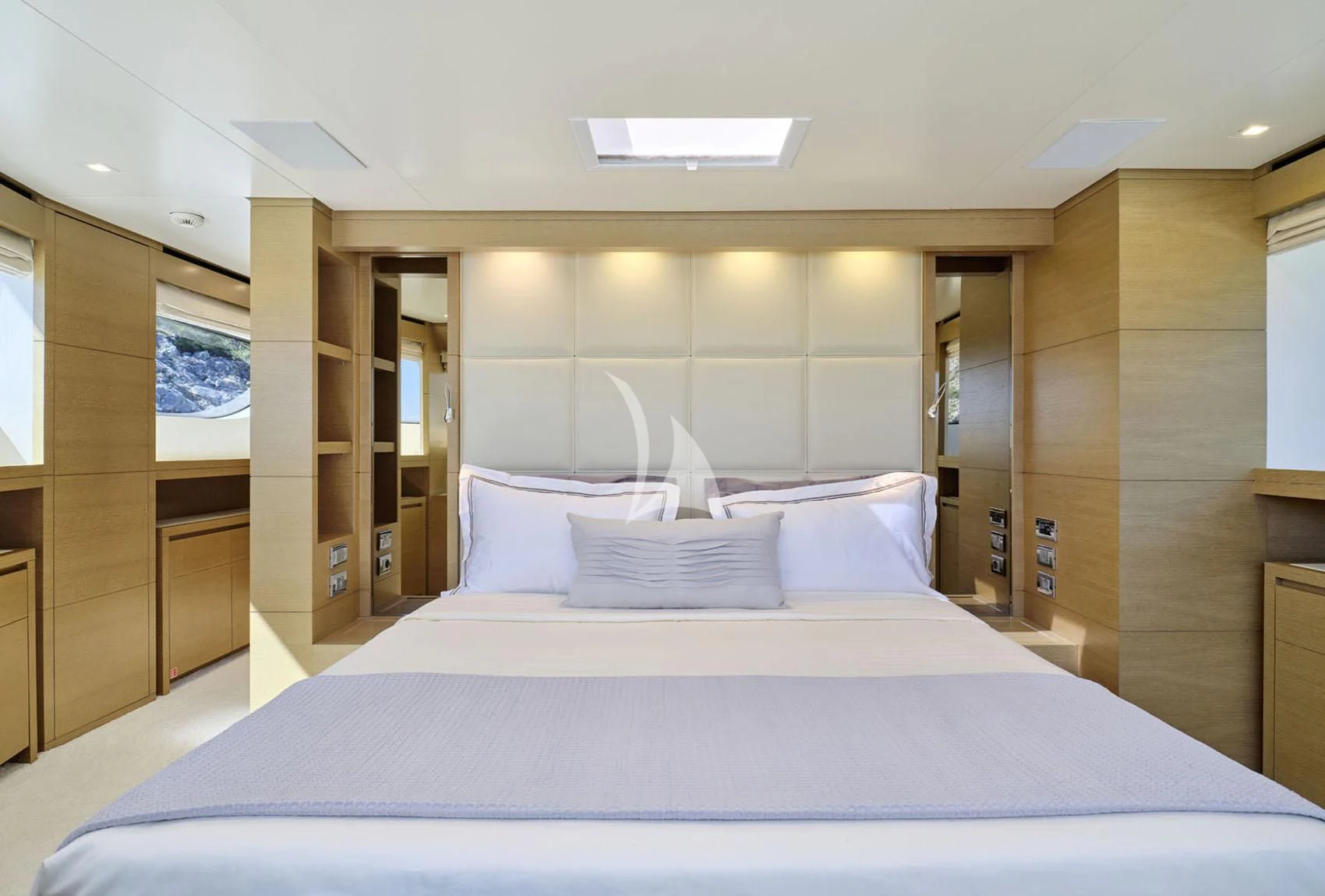 a large bed in a room aboard FLOR Yacht for Charter