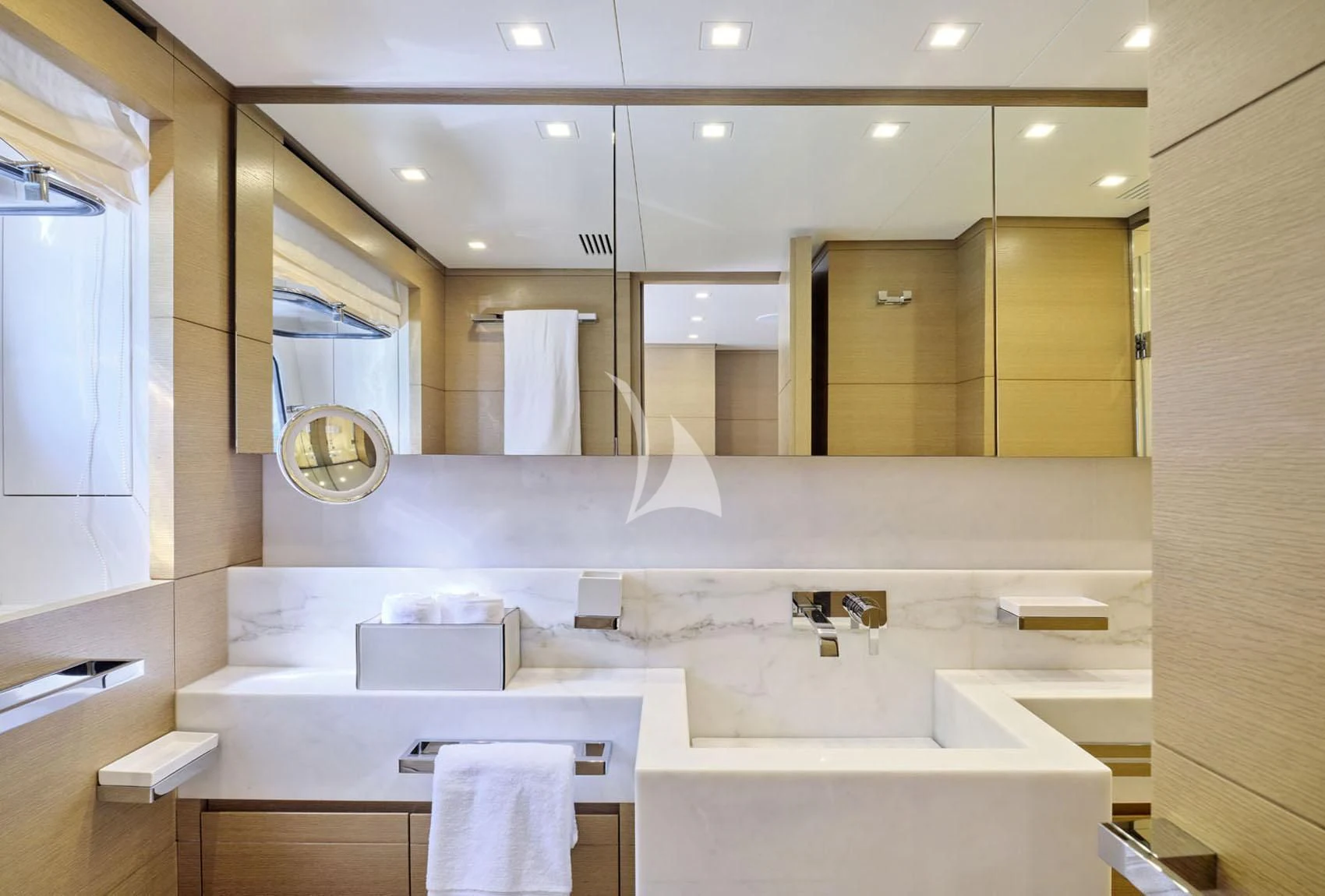 a bathroom with a large mirror aboard FLOR Yacht for Charter