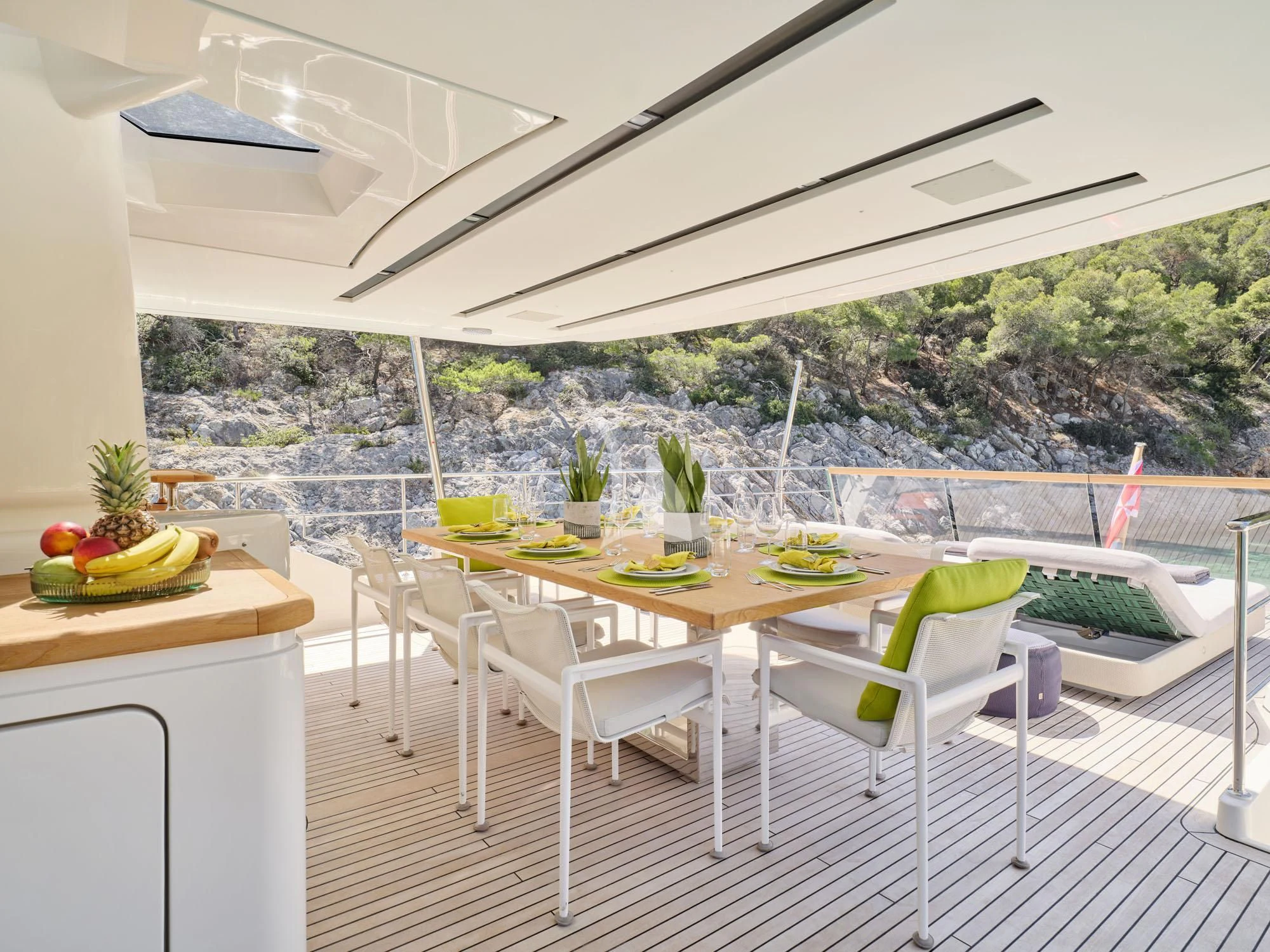 a table and chairs on a patio aboard FLOR Yacht for Charter