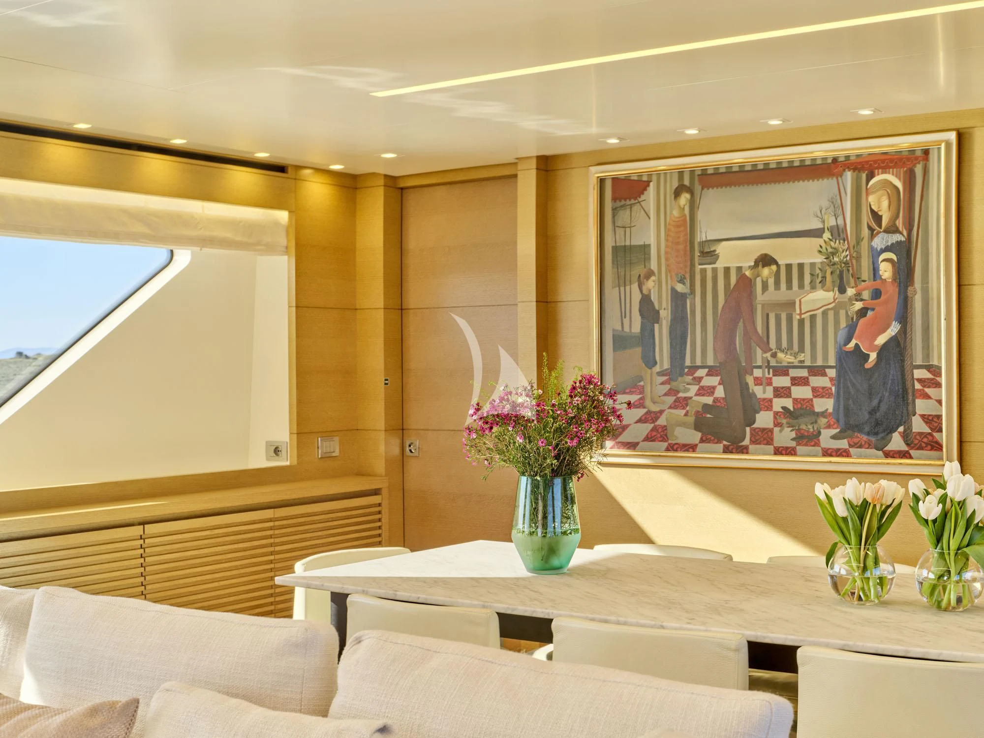 a room with a painting on the wall aboard FLOR Yacht for Charter
