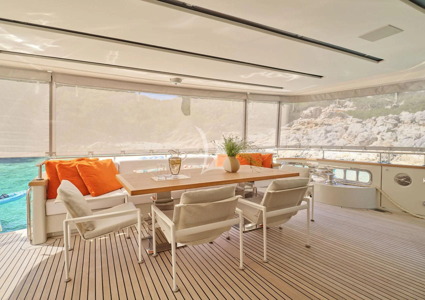 a table and chairs in a room aboard FLOR Yacht for Charter