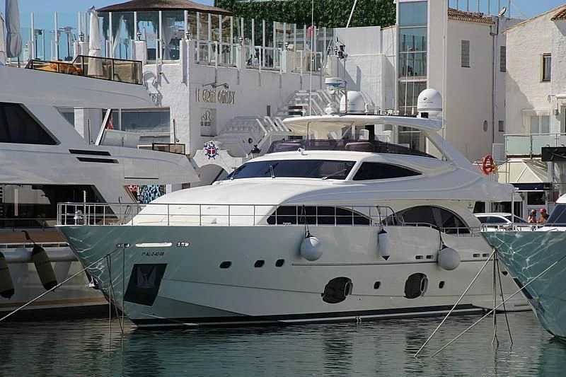a white yacht docked aboard TIO CARLOS Yacht for Sale