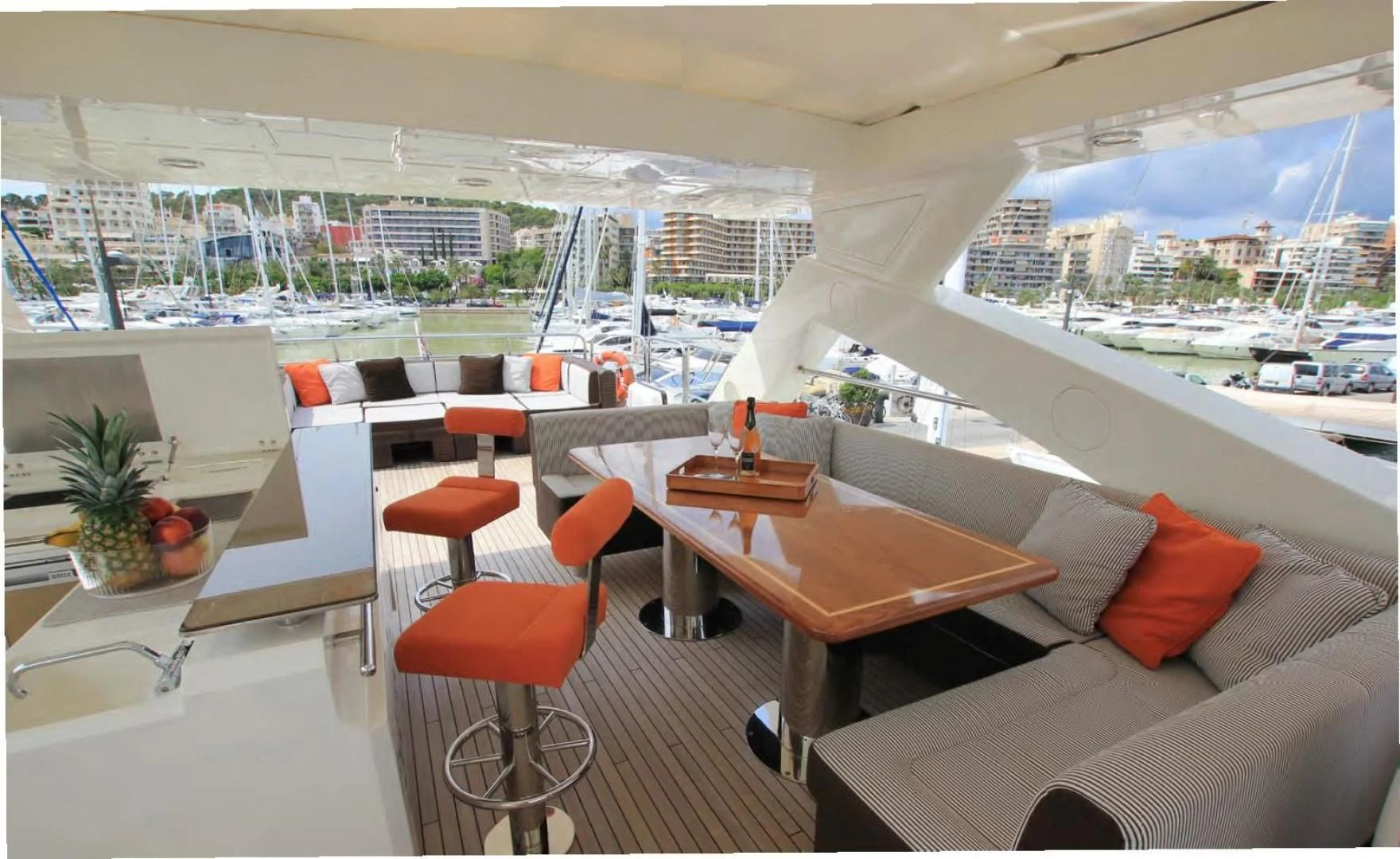 a room with a couch and a table with chairs and a table aboard ABRAHAM M Yacht for Sale