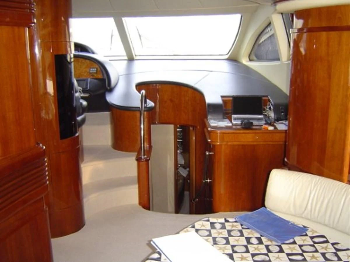 a room with a bed and desk aboard FREE SPIRIT Yacht for Sale