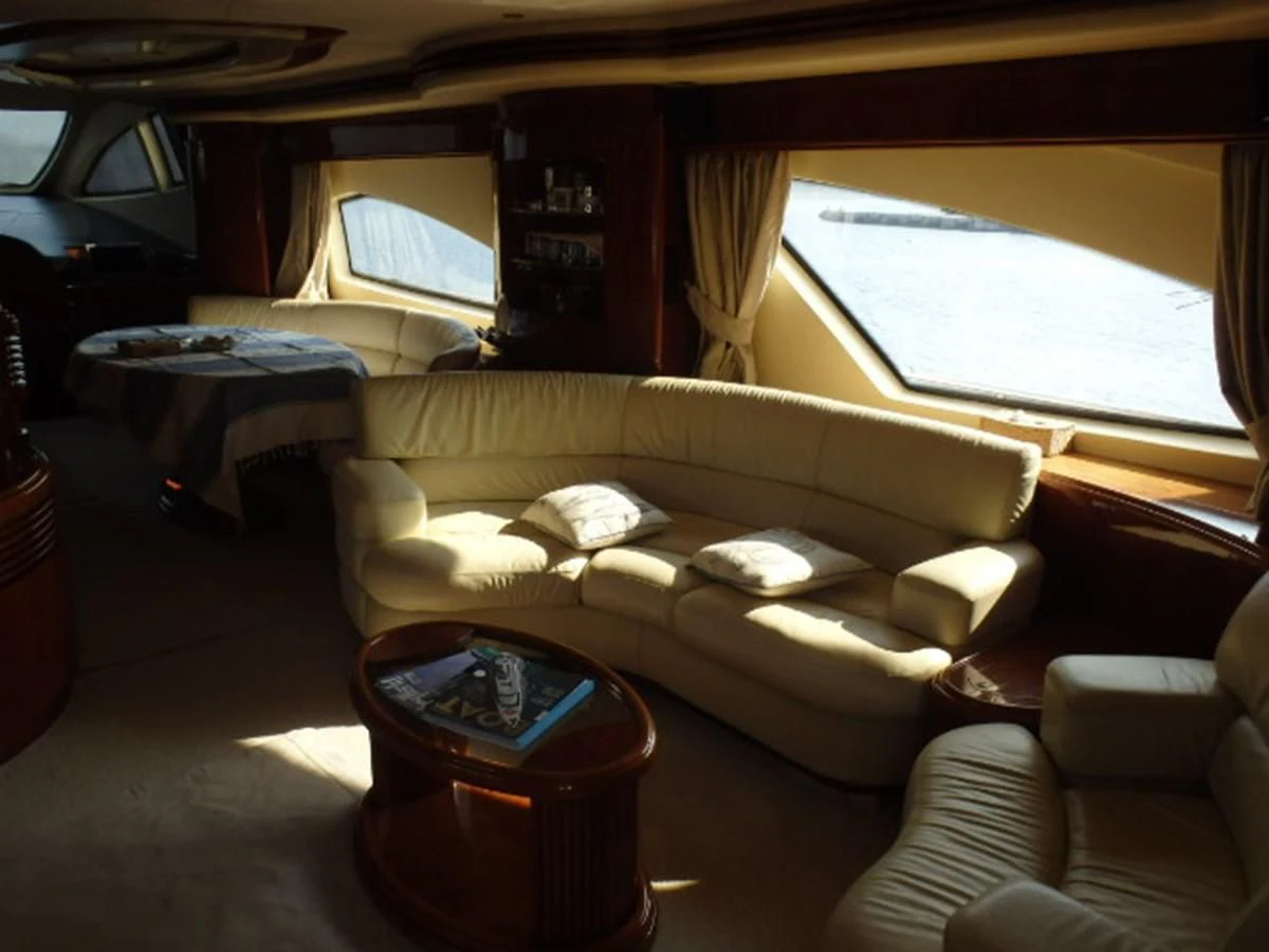 a living room with a couch and a table aboard FREE SPIRIT Yacht for Sale