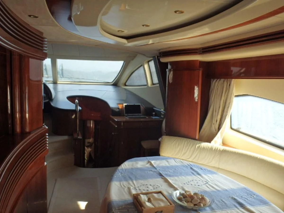 a room with a bed and a desk aboard FREE SPIRIT Yacht for Sale