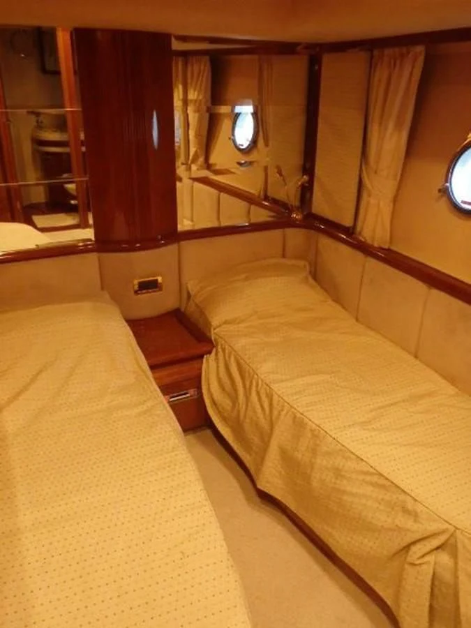 a room with two beds aboard FREE SPIRIT Yacht for Sale