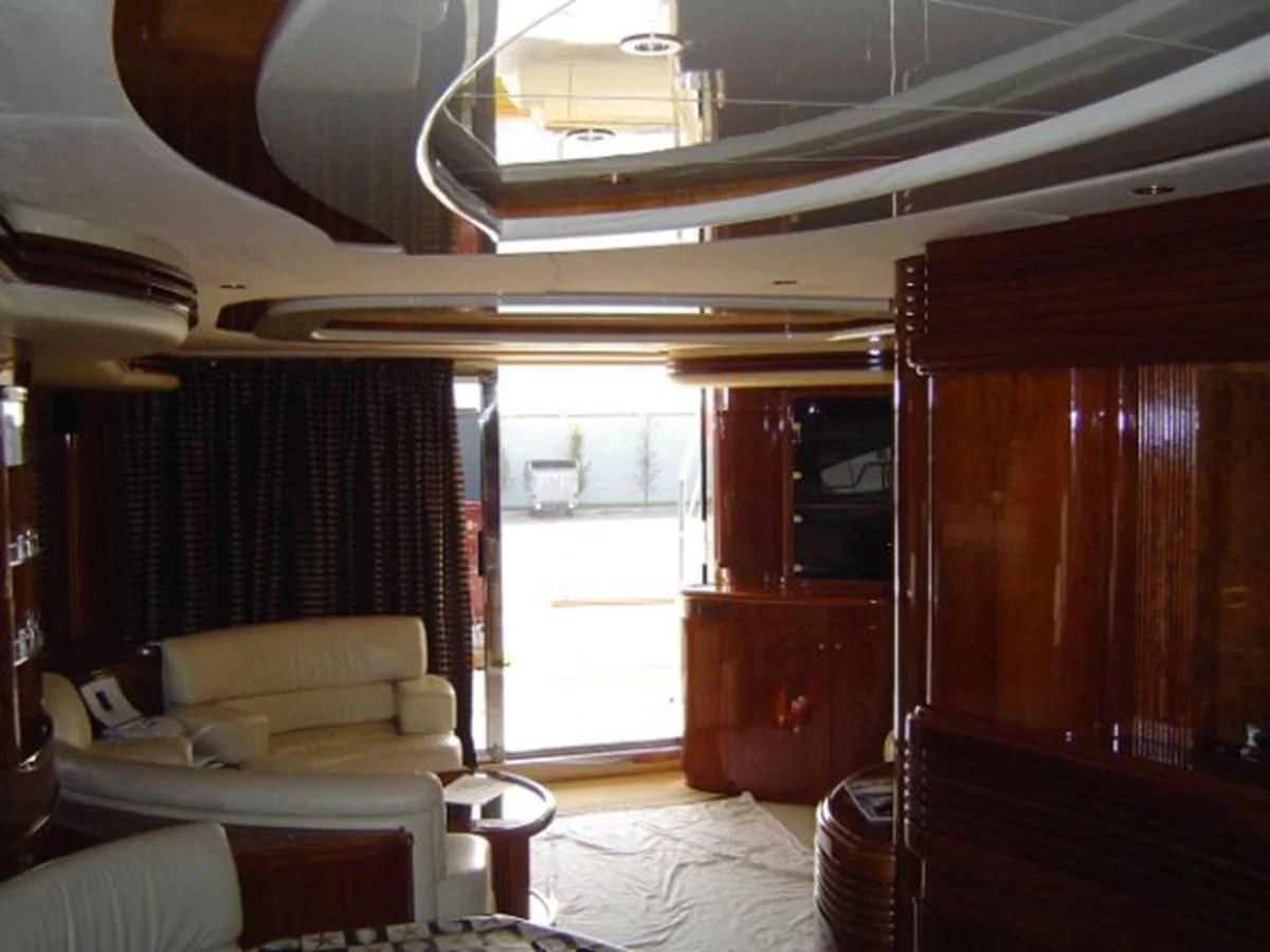 a room with a bed and a desk aboard FREE SPIRIT Yacht for Sale