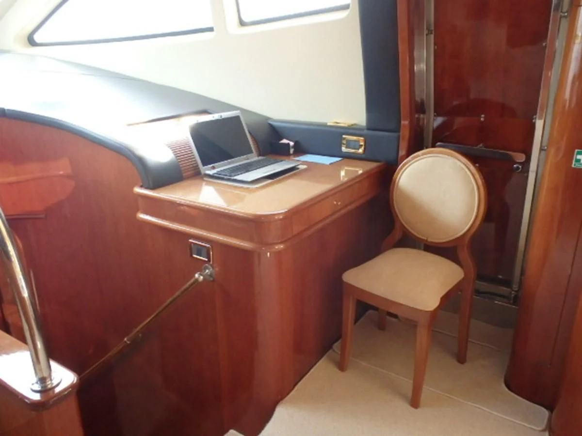 a laptop on a desk aboard FREE SPIRIT Yacht for Sale