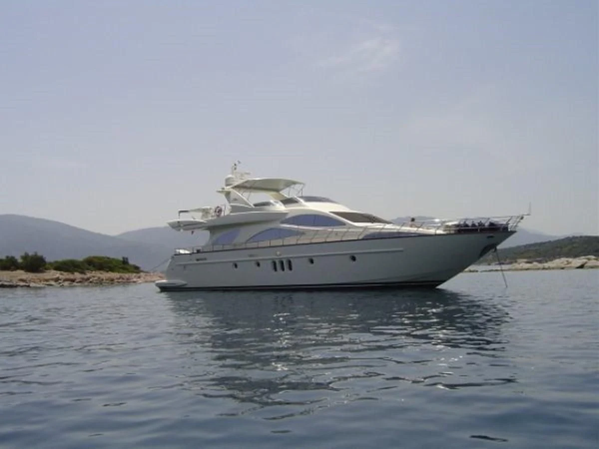 a white yacht on the water aboard FREE SPIRIT Yacht for Sale