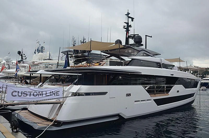 a white yacht in a harbor aboard FUNNY Yacht for Sale