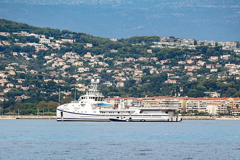 a large ship in the water aboard GARCON Yacht for Sale