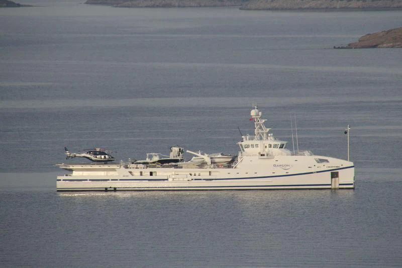 a large white ship in the water aboard GARCON Yacht for Sale