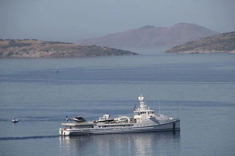 a large ship in the water aboard GARCON Yacht for Sale