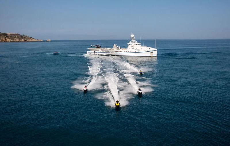 a boat with people in the water aboard GARCON Yacht for Sale