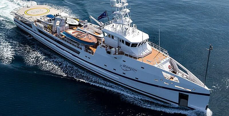 a large ship in the water aboard GARCON Yacht for Sale